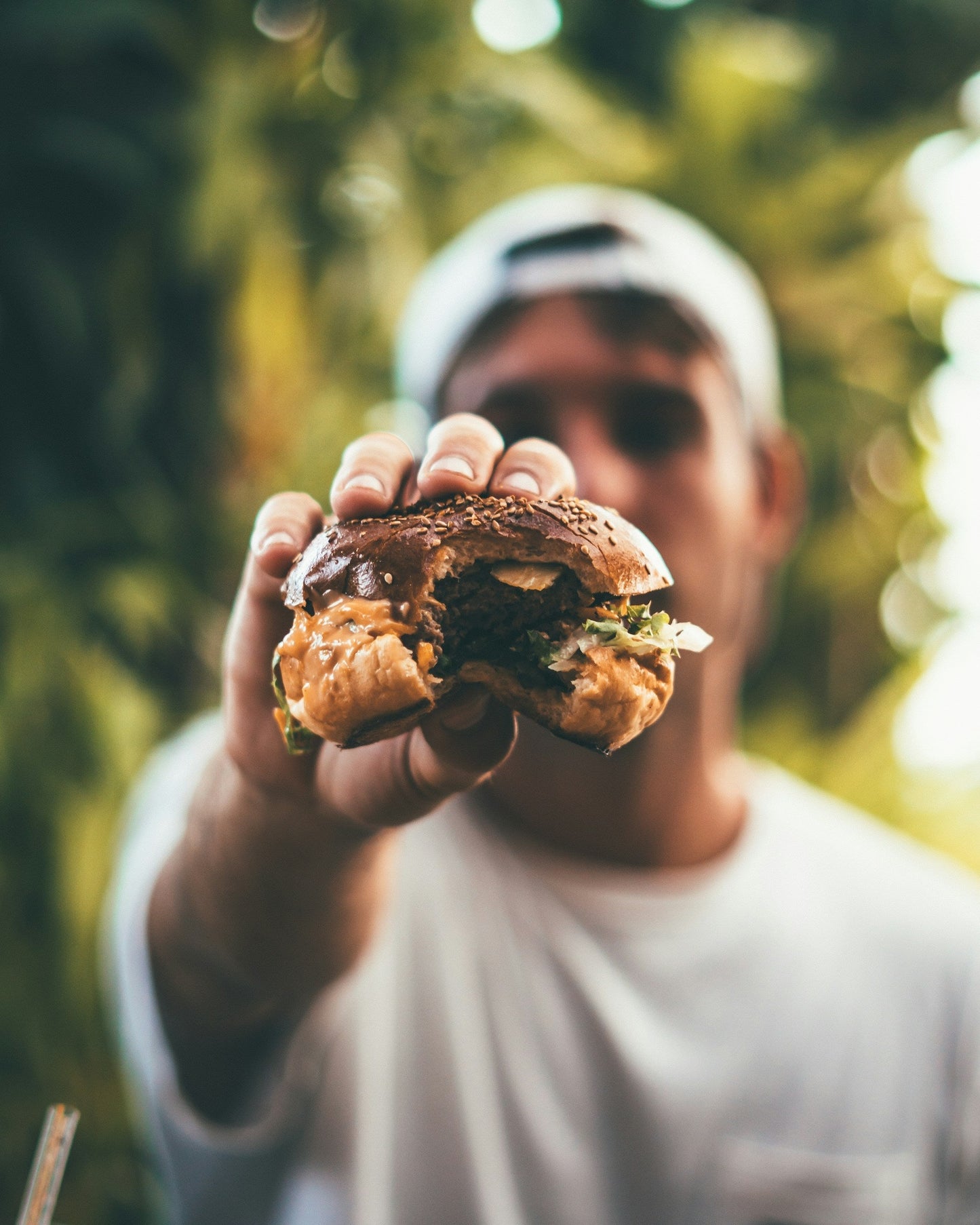Beef burgers grilling on an open flame, ready for a build-your-own burger bar